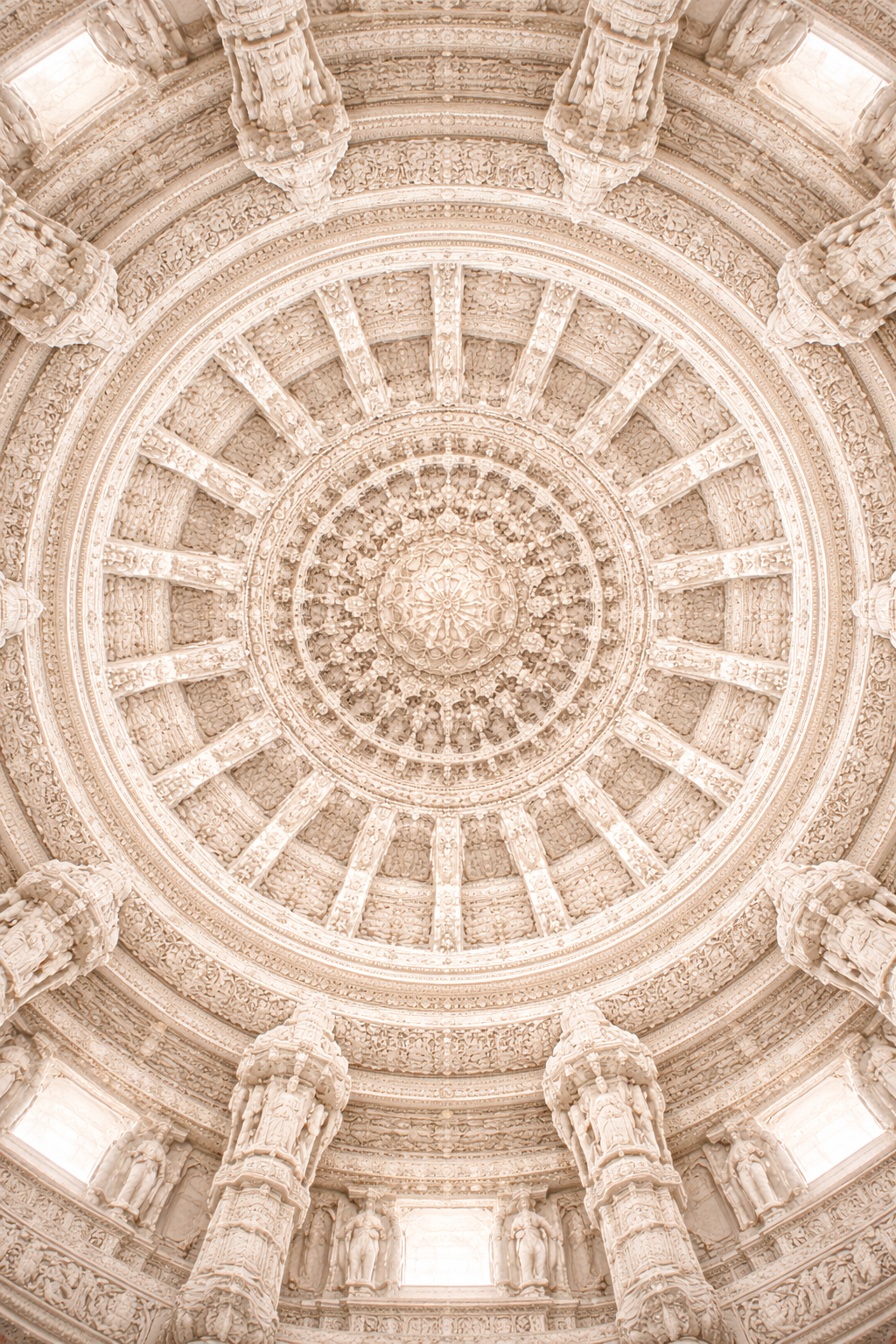 Looking straight up at a circular Jain temple ceiling vitana with intricate concentric rings of carved white marble, each ring more detailed than the last, pure white architectural masterpiece -- HD wallpaper